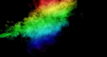 Abstract smoke isolated on black background,Rainbow powder photo