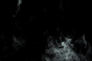 Abstract powder or smoke isolated on black background photo