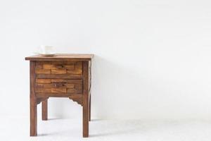 brown wood table in white room. photo