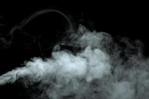 Abstract powder or smoke isolated on black background photo