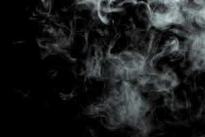 Abstract powder or smoke isolated on black background photo