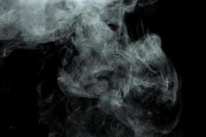 Abstract powder or smoke isolated on black background photo