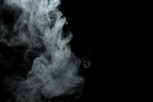 Abstract powder or smoke isolated on black background photo