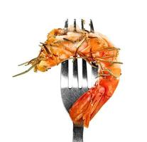 roasted peeled prawn and dry rosemary with fork isolated on white background ,grilled shrimp