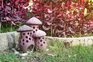 The earthenware mushroom in garden photo