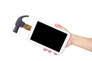 Hand holding white tablet computer with hammer,clipping path photo