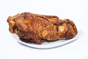 fried pork leg cooked on background photo