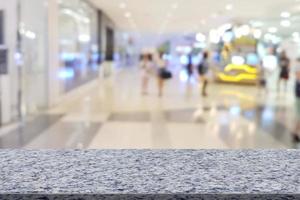 top desk with shopping mall blurred background,Marble table photo