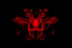 humo texturizado, rojo abstracto, aislado en fondo negro foto