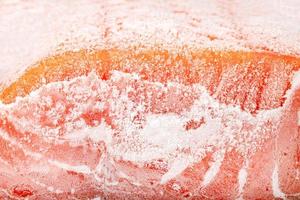 closeup piece of texture frozen salmon fillet photo