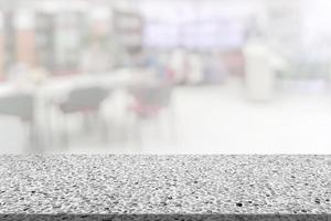 Marble table  with library blur background photo