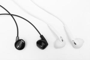 white and black earphone on white background photo