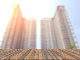 Empty wooden board space platform with blur condominium photo