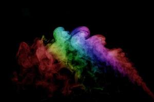 Abstract smoke isolated on black background,Rainbow powder photo