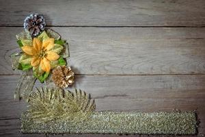 pine cones and bow on the wooden board,christmas background photo