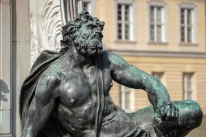 Berlin, germany, 2014. One of the four chained warriors at the base of King Frederic the Great statue Charlottenburg Palace in Berlin photo