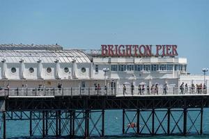 Brighton, East Sussex, UK - July 15, 2022. View of the pier in Brighton on July 15, 2022. Unidentified people photo