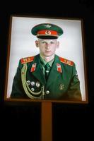 Berlin Germany, 2014. Illuminated photograph of a Soviet soldier at Checkpoint Charlie in Berlin photo