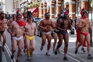 LONDON, UK - JULY 27. Friends jogging through the streets of London, UK on July 27, 2013. Unidentified people. photo