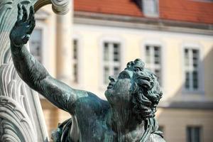 Berlin, Germany, 2014. One of the four chained warriors at the base of King Frederic the Great statue Charlottenburg Palace in Berlin photo