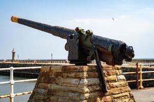 WHITBY,  NORTH YORKSHIRE, UK - JULY 19. Old battery gun in Whitby, North Yorkshire on July 19, 2022 photo