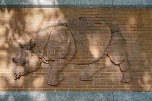 Berlin, Germany, 2014. Rhinoceros relief on the wall outside the zoo in Berlin photo