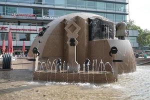 Berlin, Germany - September 15, 2014. View of J Schmettan's globe fountain in Berlin on September 15, 2014. Unidentified people photo