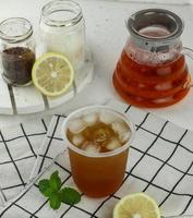 ice tea with slice of lemon in glass photo