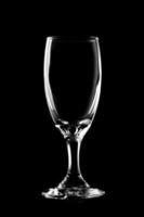 Glass of wine on black background. photo