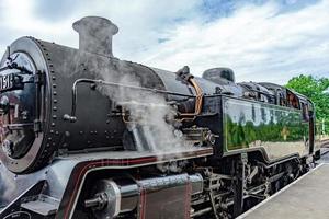 Sheffield Park East Sussex, UK - July 13 2022. View of locomotive 80151 in Sheffield Park station on July 13, 2022. One unidentified man photo