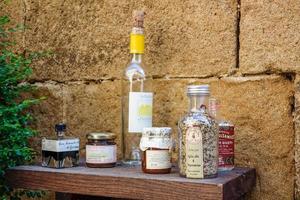 PIENZA, TUSCANY, ITALY - MAY 19. Jars and bottles on a shelf in Pienza on May 19, 2013 photo