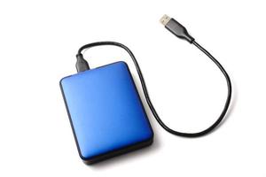 External hard disk drive with cable on a white background. photo