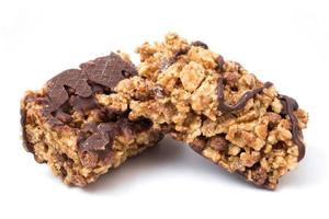 Chocolate cereal bars with wheat whole grain and chocolate on a white background. photo