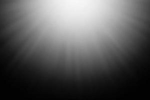 Blurred abstract light rays on a black background. photo