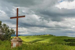 Rusty iron cross in Val d'Orcia Tuscany photo