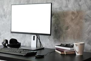 Computer with white screen monitor on the desk. photo