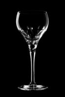 Glass of wine on black background. photo
