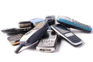 old and obsolete cellphone on a white background. photo