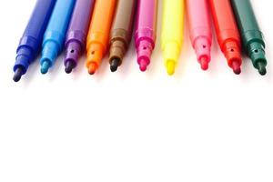 Magic colorful pens on a white background. Free space for text photo