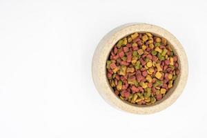 Dog food in a bowl on white background. photo