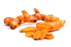 Turmeric roots on white background. photo