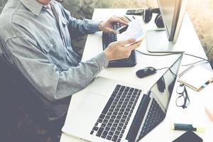 Male hands working on computer and tablet, Software programming web development concept photo