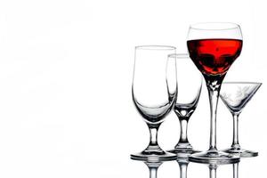 Collage of empty glasses with wine on white background. Free space for text photo