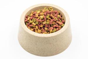 Dog food in a bowl on white background. photo