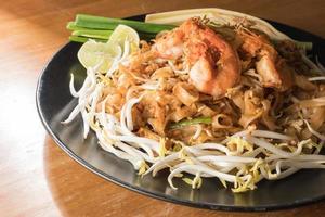 Close up plate of Padthai, Thai noodle with fried shrimp and vegetable,Thai Food, Thailand's national dishes. photo