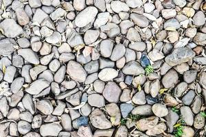 Stone background. Pile of stones on the ground. photo