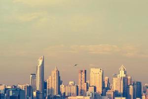 Modern building in business district at Bangkok city, Thailand. Vintage tone photo