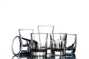 Collage of empty glasses on white background. photo