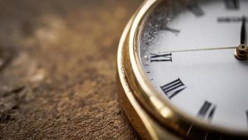Close up front view of a modern wrist watch on the table. Soft focus. Free space for text photo