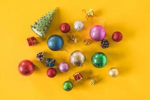 Top view of Christmas decorations on a yellow background. photo